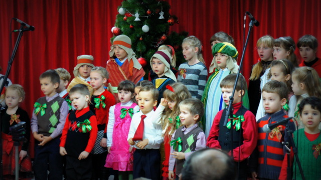 Mishael singing with the children's choir